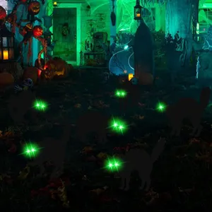 Halloween black cat yard stakes with glowing green eyes for spooky outdoor lawn decor.