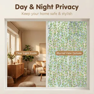 Detail shot of decorative window privacy film with green leaf pattern, providing clear light inside.