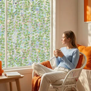 Decorative static window glass film with green leaf pattern for home privacy and window decor.
