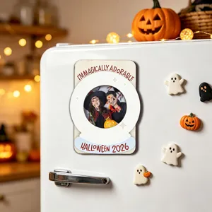Detail view of the Halloween wooden magnetic photo frame attached to a fridge with festive props.