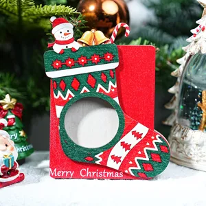 Christmas wooden photo frame desktop decoration with cute snowman and festive stocking design.