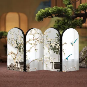 Detail shot of the tabletop folding screen featuring traditional plum blossom and bird patterns.