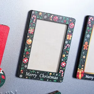 Close-up detail of wooden Christmas fridge magnet photo frame with festive holiday patterns.