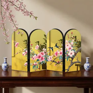 Detailed view of the creative Chinese style golden mirror folding screen tabletop ornament with floral art.