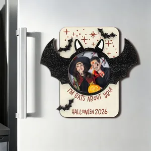 Detailed view of Halloween wooden magnetic photo frame with bat wings and festive text.