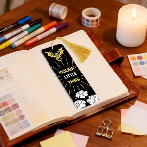 Creative black bookmark with golden tassel, dragon pattern and english quote design.