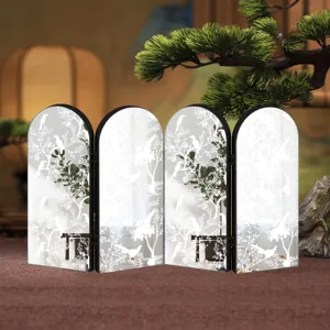 Details of the arched mirror screen with Chinese botanical art for desktop decoration.