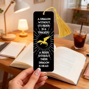 Black acrylic bookmark with golden tassel and inspirational fantasy quote design.