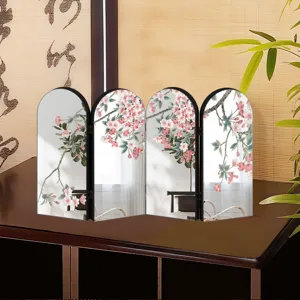 Chinese style folding screen mirror desktop ornament with cherry blossom design detail.