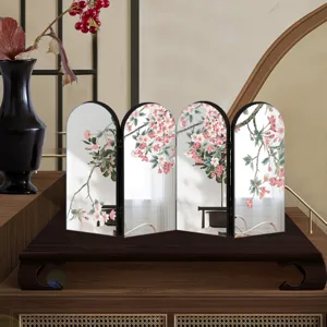 Exquisite miniature folding screen detail, featuring delicate cherry blossom art on mirror panels.