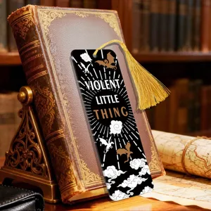 Detailed close-up of the acrylic bookmark with golden tassel and vintage design elements.