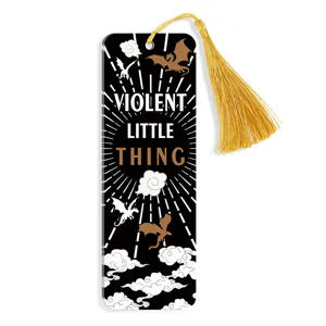 Creative acrylic bookmark with gold tassel, black dragon pattern and quote for reading.