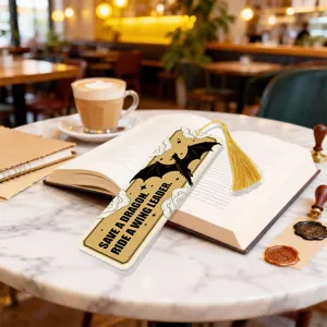 Acrylic bookmark with tassel, translucent design with dragon silhouette and inspiring quote for readers.