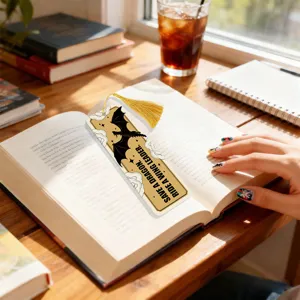 Creative acrylic bookmark featuring a dragon design and gold tassel for reading appeal.