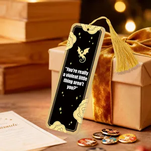 Acrylic bookmark with golden tassel, literary quote and dragon design for readers.