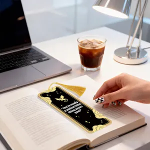 Creative metal acrylic bookmark with gold tassel and quote design, elegant reading accessory.