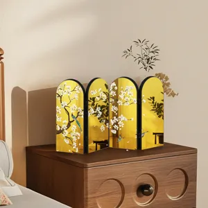 Detailed shot of Chinese style mini gold folding screen tabletop decor with plum blossom.