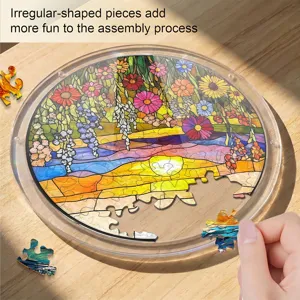 Detailed view of round floral stained glass acrylic puzzle with clear tray and hand placing piece.