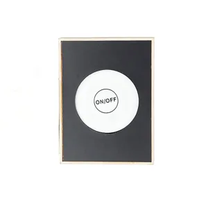 Detailed shot of magnetic fridge sticker with switch pattern and wooden frame, compact design.