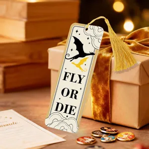 Detailed close-up of the translucent acrylic bookmark featuring a dragon design and gold tassel.