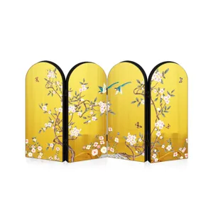 Detailed view of traditional Chinese style gold mirror desktop screen ornament with floral art.