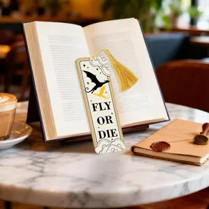 Acrylic tassel bookmark with dragon design and quote, perfect reading accessory for book lovers.