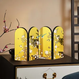 Chinese style tabletop folding screen detail, gold mirror finish with floral and bird art decor.
