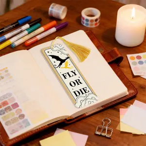 Creative acrylic bookmark with golden tassel, translucent refractive design for reading lovers.