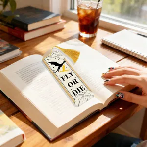 Acrylic bookmark detail view featuring dragon silhouette design and elegant golden tassel accessory.