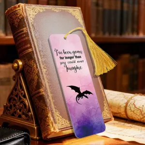 Detailed close-up of the translucent gradient acrylic bookmark with a dragon and elegant quote.