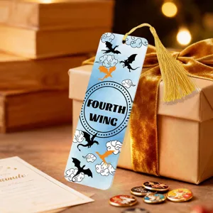 Decorative acrylic bookmark featuring golden tassel and dragon fantasy book theme for readers.
