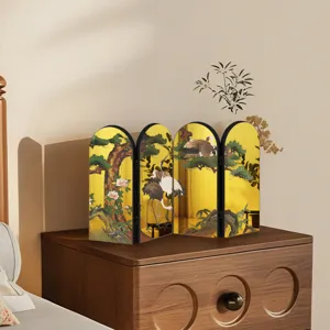 Detailed view of traditional Chinese style miniature folding screen tabletop decor with crane and pine.