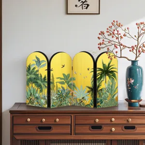 Detail shot of the decorative folding mini screen with tropical jungle pattern on wooden desk.