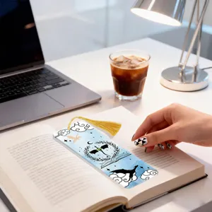 Creative acrylic bookmark with golden tassel, fantasy dragon design for reading lovers.