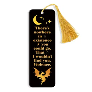 Detailed close-up of black acrylic bookmark with gold quote and elegant tassel for book lovers.