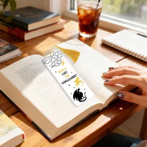 Creative acrylic bookmark with golden tassel, featuring dragon and quote design for readers.
