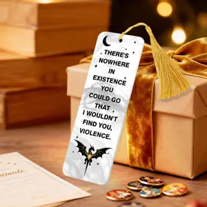 Clear acrylic bookmark with golden tassel and motivational quote design for reading lovers.