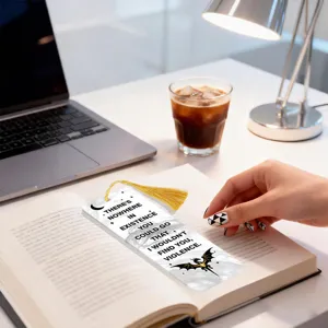 Acrylic transparent bookmark with tassel, scenic desk display detail showcasing quote and dragon.