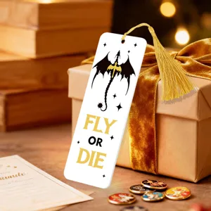 Creative white bookmark with dragon graphic and gold tassel, perfect for book lovers.