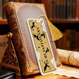 Acrylic bookmark with golden tassel, fantasy dragon pattern, vintage style reading accessory.