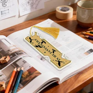 Acrylic decorative bookmark with golden dragon pattern and yellow tassel for reading.
