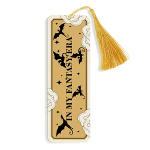 Detailed view of creative fantasy style dragon bookmark with elegant gold tassel and print.
