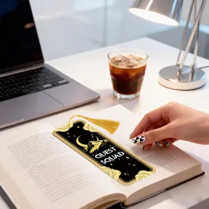 Acrylic black gold tassel bookmark with celestial moon and star design for reading books.
