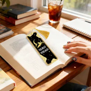 Acrylic bookmark with gold tassel, black and gold moon mountain design for reading lovers.