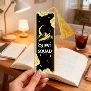 Detailed view of the translucent acrylic bookmark with a gold tassel and moon star design.