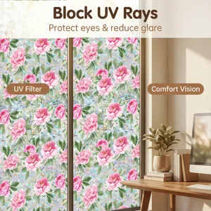 Close-up view of static window film with beautiful pink floral peony design for privacy.