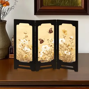 Detailed view of traditional Chinese style mini folding screen desktop ornament with floral butterfly art.
