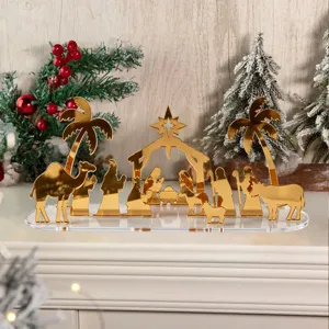 Décoration de table de crèche de Noël en acrylique doré avec socle transparent et arbres.