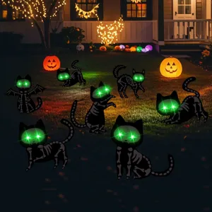 Halloween black cat yard signs with glowing green eyes, spooky outdoor lawn decor for party.