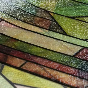 Close up of 3D embossed stained glass window film, geometric pattern texture detail.
